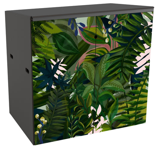 A 2 bin store with a jungle vibe. The image has some flat graphic background leaf shapes in dark blue, grey green, white and yellow green which are mostly covered by simple painterly  depictions of fronds, ferns, broad striped leaves of hostas with flashes of pink,  all overlapping. Leaves  are large , broad or  more intricate resembling mistletoe or with alternate leaves in graduated tones. 