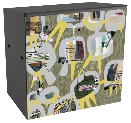 Garden storage with a mid-century modern style design across the doors. The background is a light grey-brown with olive coloured scribbles. On top is a pattern of  12 abstract grey rounded shapes. Superimposed on these are cuboids revealing black linear drawn lines suggestive of an insect wing on top of bands of colour washes in subtle colours. Sharp long triangles suggestive of sunflower petals jut out from sections of the grey shapes and act as a counterbalance to the rounded forms. 