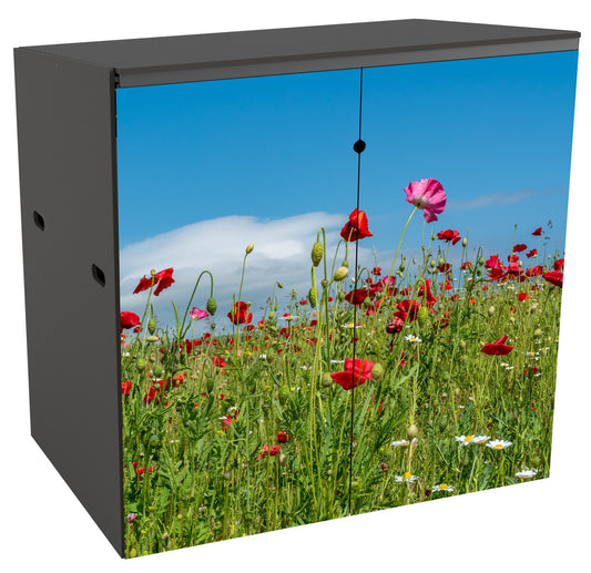 A 2 bin garden storage unit seen from the front. The doors show a vibrant photo of a meadow of poppies. The top half is mainly a bright blue sky with a wispy cloud and the bottom half is a close-up view, from a low angle, of a mass of green stems with poppy heads in red and pinks against the sky. The blooms are at actual size . Some daisies and yet-to-open buds add variety to the image.